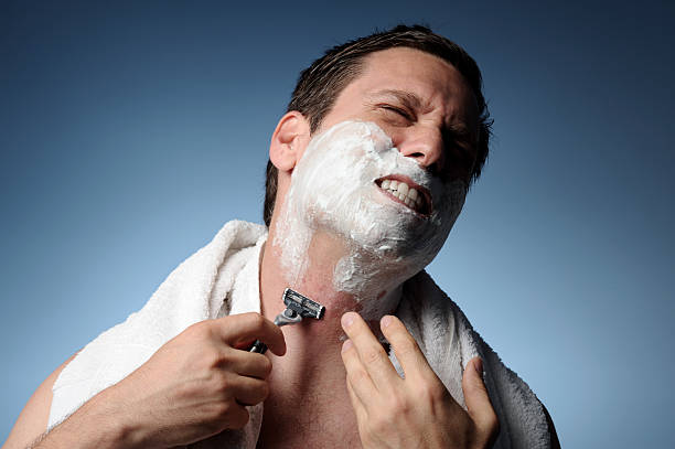 Man Shaving With Razor Burn