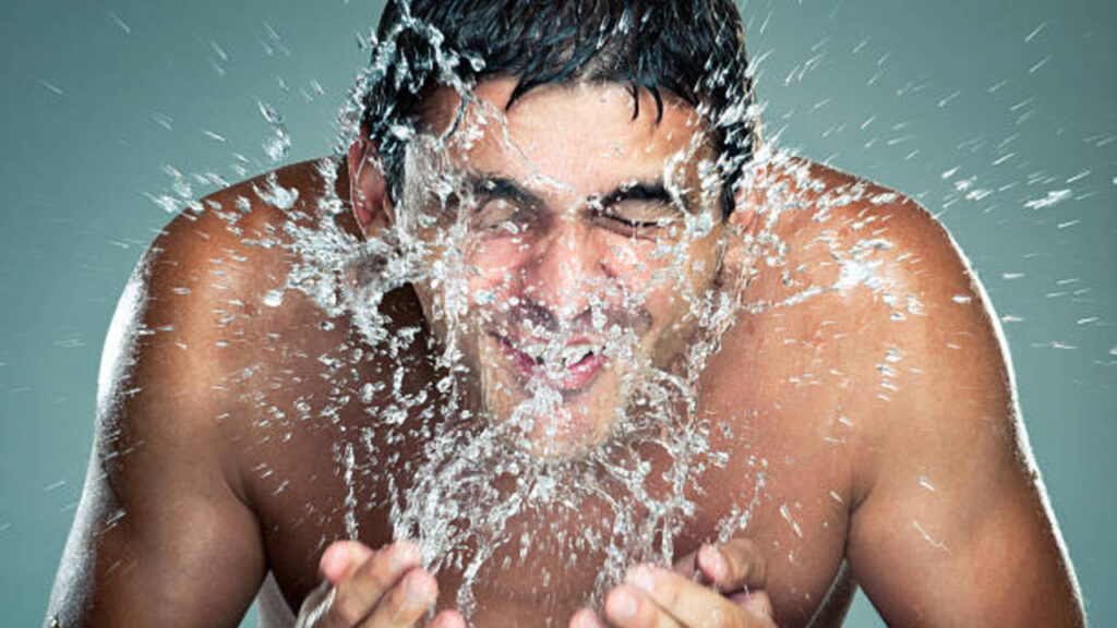 rinsing face with cold water